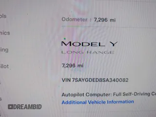 2025 Tesla Model Y Long Range with VIN 7SAYGDED8SA340082, listed as a IAAI auction lot 41915369 with 7,296 mi miles and . Bid and sale history available at carsss.com. Image 16.