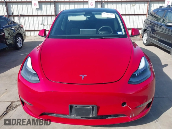 2022 Tesla Model Y Performance z VIN 7SAYGDEF0NF518740, wystawiony jako IAAI lot #41785358 z przebiegiem 50 692 mil mil oraz . Historia ofert i sprzedaży dostępna na DreamBid. Obrazek 13.