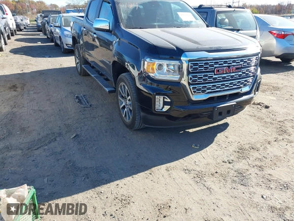 2021 GMC Canyon 4WD Denali z VIN 1GTG6EEN9M1240596, wystawiony jako IAAI lot #40760124 z przebiegiem 52 985 mil mil oraz . Historia ofert i sprzedaży dostępna na DreamBid. Obrazek 1.