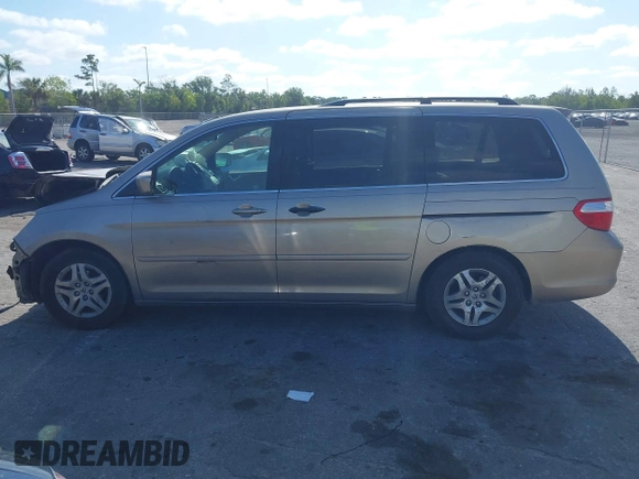 2005 Honda Odyssey EX with VIN 5FNRL38495B401742, listed as a IAAI auction lot 42133434 with 162,161 mi miles and . Bid and sale history available at carsss.com. Image 15.