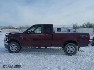 2000 Ford F-150 XL with VIN 1FTRX18L2YNA50128, listed as a IAAI auction lot 40956879 with 1 mi miles. Bid and sale history available at carsss.com. Image 13.