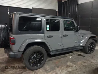 2022 Jeep Wrangler Unlimited Sahara with VIN 1C4JJXP66NW198723, listed as a IAAI auction lot 41368728 with 31,814 mi miles and . Bid and sale history available at DreamBid. Image 4.