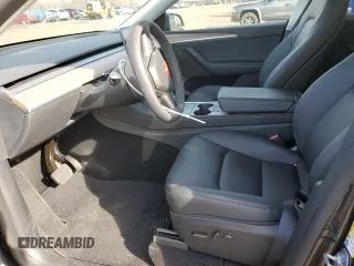2025 Tesla Model Y Long Range with VIN 7SAYGDEE4SF291068, listed as a Copart auction lot 51204615 with 2,958 mi miles and Salvage Title. Bid and sale history available at DreamBid. Image 7.