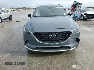 2021 Mazda CX-9 Grand Touring z VIN JM3TCADYXM0519757, wystawiony jako Copart lot #86665134 z przebiegiem 51 217 mil mil oraz Szkoda całkowita • Salvage title. Historia ofert i sprzedaży dostępna na DreamBid. Obrazek 12.