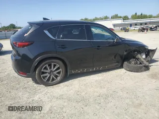 2018 Mazda CX-5 Grand Touring z VIN JM3KFBDM0J0399985, wystawiony jako Copart lot #54097665 z przebiegiem 45 344 mil mil oraz Szkoda całkowita • Salvage title. Historia ofert i sprzedaży dostępna na DreamBid. Obrazek 3.