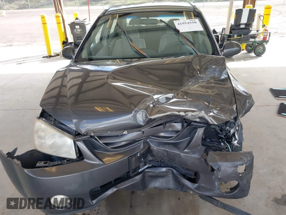 2004 Kia Spectra LX with VIN KNAFE121145031237, listed as a IAAI auction lot 41954550 with 133,744 mi miles. Bid and sale history available at carsss.com. Image 6.