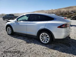 2016 Tesla Model X 70D with VIN 5YJXCAE29GF004033, listed as a Copart auction lot 49673975 with 220,259 mi miles and Salvage Title. Bid and sale history available at DreamBid. Image 2.