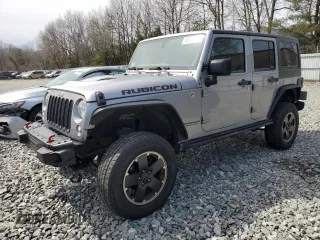 2015 Jeep Wrangler Unlimited Rubicon Hard Rock with VIN 1C4HJWFG4FL575054, listed as a Copart auction lot 51672655 with 130,405 mi miles and Clean title. Bid and sale history available at DreamBid. Image 1.