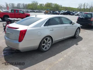2013 Cadillac XTS Luxury z VIN 2G61P5S3XD9178601, wystawiony jako IAAI lot #42154859 z przebiegiem 111 227 mil mil oraz . Historia ofert i sprzedaży dostępna na DreamBid. Obrazek 4.