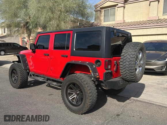 2018 Jeep Wrangler JK Unlimited Sport S with VIN 1C4BJWDG7JL828871, listed as a Copart auction lot 87530425 with 60,958 mi miles and Clean Title. Bid and sale history available at carsss.com. Image 3.