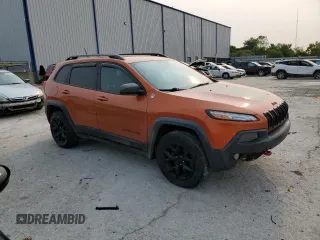 2015 Jeep Cherokee Trailhawk with VIN 1C4PJMBS0FW675807, listed as a Copart auction lot 58800615 with 109,019 mi miles and Salvage title. Bid and sale history available at DreamBid. Image 4.