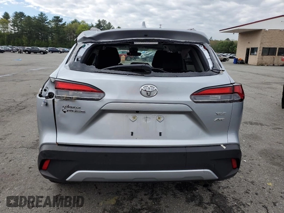 2022 Toyota Corolla Cross XLE with VIN 7MUDAABG2NV009663, listed as a Copart auction lot 55945735 with 59,473 mi miles and Salvage title. Bid and sale history available at DreamBid. Image 6.