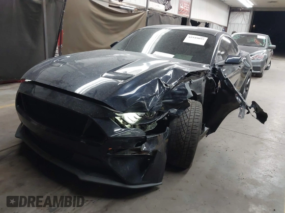 2021 Ford Mustang EcoBoost with VIN 1FA6P8TH0M5110017, listed as a IAAI auction lot 41949095 with 50,321 mi miles and . Bid and sale history available at DreamBid. Image 2.