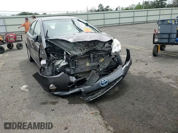 2014 Toyota Prius One z VIN JTDKDTB33E1066355, wystawiony jako Copart lot #58524285 z przebiegiem Nie podano mil oraz Szkoda całkowita • Salvage title. Historia ofert i sprzedaży dostępna na DreamBid. Obrazek 13.
