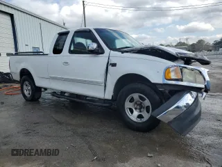2000 Ford F-150 XL with VIN 1FTZX1727YNB23518, listed as a Copart auction lot 43914215 with 0 mi miles and Salvage Title. Bid and sale history available at carsss.com. Image 4.