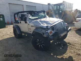 2003 Jeep Wrangler Rubicon z VIN 1J4FA69S53P375189, wystawiony jako Copart lot #54292035 z przebiegiem 55 863 mil mil oraz Szkoda całkowita • Salvage title. Historia ofert i sprzedaży dostępna na DreamBid. Obrazek 13.