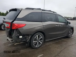 2018 Honda Odyssey Elite z VIN 5FNRL6H94JB107589, wystawiony jako Copart lot #58347385 z przebiegiem 98 761 mil mil oraz Szkody całkowita. Historia ofert i sprzedaży dostępna na DreamBid. Obrazek 3.