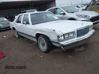 1991 Mercury Grand Marquis z VIN 2MECM75F2MX678620, wystawiony jako IAAI lot #41545796 z przebiegiem 52 567 mil mil oraz . Historia ofert i sprzedaży dostępna na DreamBid. Obrazek 1.