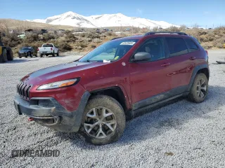 2014 Jeep Cherokee Trailhawk with VIN 1C4PJMBS7EW157305, listed as a Copart auction lot 49436685 with 138,446 mi miles and Salvage Title. Bid and sale history available at carsss.com. Image 1.