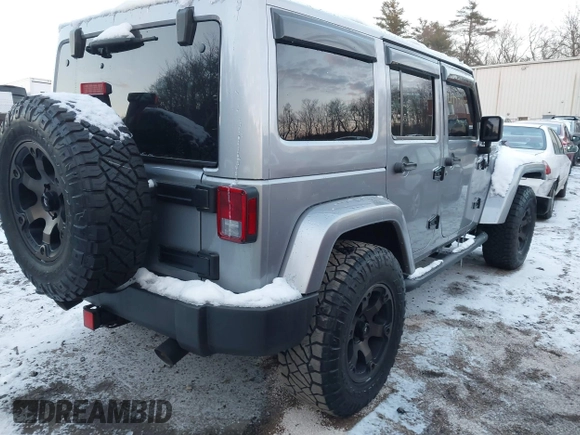 2015 Jeep Wrangler Unlimited Rubicon Hard Rock with VIN 1C4HJWFG1FL659803, listed as a IAAI auction lot 41172485 with 126,881 mi miles and . Bid and sale history available at DreamBid. Image 4.