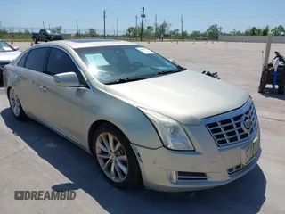 2014 Cadillac XTS Premium with VIN 2G61P5S33E9157607, listed as a IAAI auction lot 42004612 with 111,047 mi miles and . Bid and sale history available at DreamBid. Image 1.