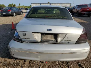 2000 Ford Crown Victoria with VIN 2FAFP73W5YX181565, listed as a Copart auction lot 77098594 with 180,439 mi miles and Salvage Title. Bid and sale history available at carsss.com. Image 6.