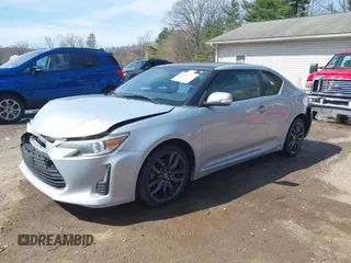 2014 Scion tC with VIN JTKJF5C70E3068144, listed as a IAAI auction lot 41983751 with 137,894 mi miles. Bid and sale history available at carsss.com. Image 2.