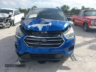 2018 Ford Escape SE z VIN 1FMCU0GD2JUC27271, wystawiony jako IAAI lot #41947047 z przebiegiem 154 672 mil mil oraz . Historia ofert i sprzedaży dostępna na DreamBid. Obrazek 6.
