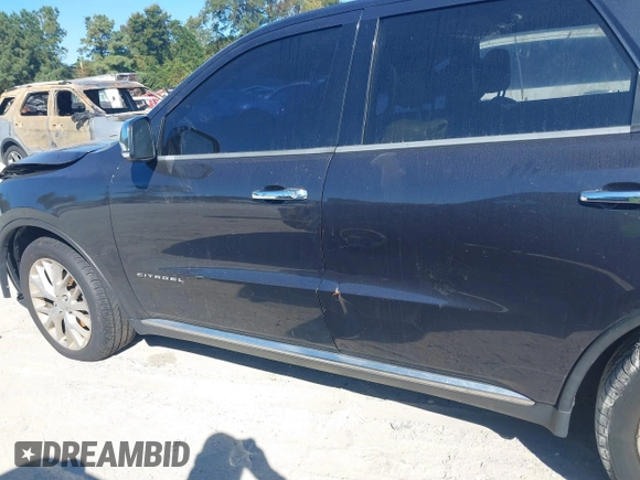 2014 Dodge Durango Citadel with VIN 1C4SDJETXEC390326, listed as a IAAI auction lot 40620779 with 119,537 mi miles and . Bid and sale history available at DreamBid. Image 14.