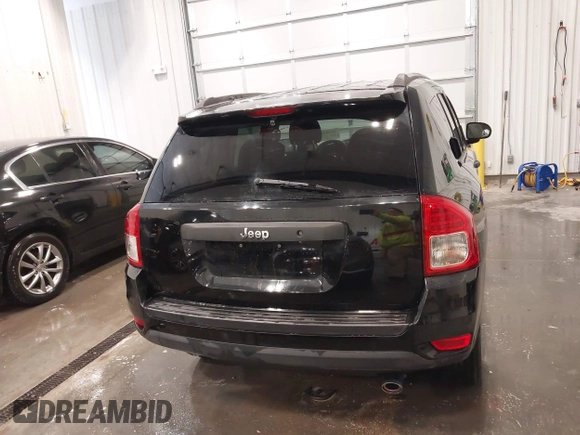 2014 Jeep Compass Sport with VIN 1C4NJCBA3ED777881, listed as a IAAI auction lot 41845518 with 113,566 mi miles. Bid and sale history available at carsss.com. Image 17.