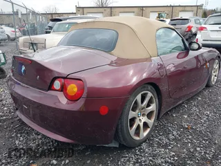 2004 BMW Z4 2.5i with VIN 4USBT33544LS50607, listed as a IAAI auction lot 42055929 with 156,585 mi miles. Bid and sale history available at carsss.com. Image 4.