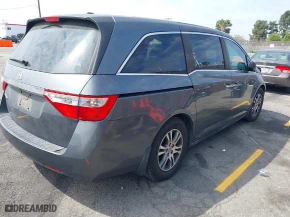 2011 Honda Odyssey EX-L with VIN 5FNRL5H63BB068205, listed as a IAAI auction lot 42034057 with 106,443 mi miles. Bid and sale history available at carsss.com. Image 4.