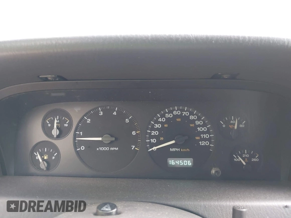 1999 Jeep Grand Cherokee Limited with VIN 1J4GW68N5XC684157, listed as a IAAI auction lot 42104283 with 164,506 mi miles. Bid and sale history available at carsss.com. Image 7.