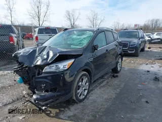 2014 Ford Escape Titanium with VIN 1FMCU9J9XEUC15464, listed as a IAAI auction lot 41524925 with 160,445 mi miles. Bid and sale history available at carsss.com. Image 2.