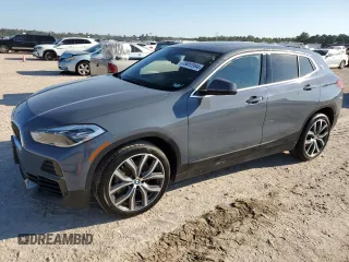 2021 BMW X2 xDrive28i with VIN WBXYJ1C04M5S07696, listed as a Copart auction lot 73412384 with 35,004 mi miles and Salvage Title. Bid and sale history available at carsss.com. Image 1.