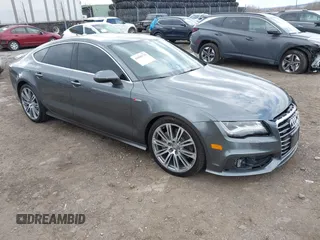 2014 Audi A7 Prestige with VIN WAU2GAFC7EN017882, listed as a IAAI auction lot 41896776 with 97,342 mi miles and . Bid and sale history available at DreamBid. Image 1.