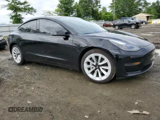 2023 Tesla Model 3 with VIN 5YJ3E1EA3PF451764, listed as a Copart auction lot 58718705 with 33,965 mi miles and Salvage title. Bid and sale history available at DreamBid. Image 4.