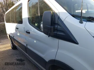 2021 Ford Transit Passenger XL z VIN 1FBAX2Y89MKA49850, wystawiony jako IAAI lot #41602893 z przebiegiem 74 248 mil mil oraz . Historia ofert i sprzedaży dostępna na DreamBid. Obrazek 13.