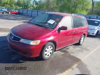 2004 Honda Odyssey EX with VIN 5FNRL18644B122591, listed as a IAAI auction lot 42207036 with 166,179 mi miles and . Bid and sale history available at DreamBid. Image 2.