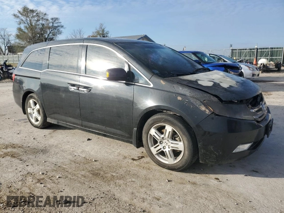 2012 Honda Odyssey Touring with VIN 5FNRL5H9XCB022284, listed as a Copart auction lot 82766824 with Not provided miles and Salvage title. Bid and sale history available at DreamBid. Image 4.
