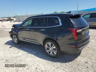 2024 Cadillac XT6 Premium Luxury z VIN 1GYKPERS1RZ755490, wystawiony jako Copart lot #49706575 z przebiegiem 4 239 mil mil oraz Szkoda całkowita • Salvage title. Historia ofert i sprzedaży dostępna na DreamBid. Obrazek 2.