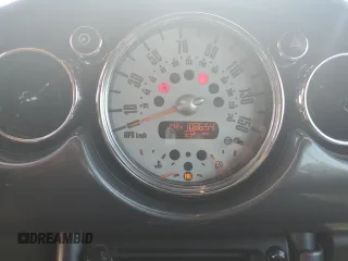 2006 MINI Convertible with VIN WMWRF33576TG16056, listed as a Copart auction lot 63127705 with 108,654 mi miles and Salvage title. Bid and sale history available at DreamBid. Image 9.