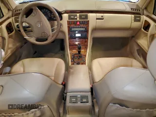 2002 Mercedes-Benz E-Class with VIN WDBJF65J12B485293, listed as a Copart auction lot 77561984 with 140,708 mi miles and Salvage Title. Bid and sale history available at carsss.com. Image 8.