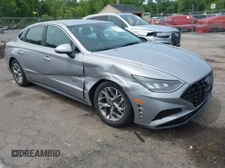 2023 Hyundai Sonata SEL z VIN KMHL64JA9PA281712, wystawiony jako IAAI lot #42371067 z przebiegiem 27 982 mil mil oraz . Historia ofert i sprzedaży dostępna na DreamBid. Obrazek 1.