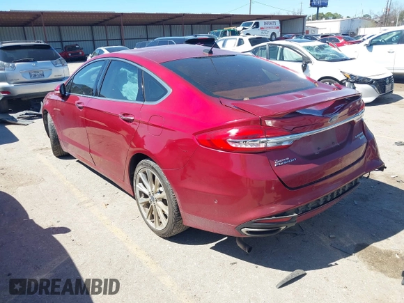 2017 Ford Fusion Titanium with VIN 3FA6P0K90HR184777, listed as a IAAI auction lot 41722188 with 116,654 mi miles. Bid and sale history available at carsss.com. Image 3.
