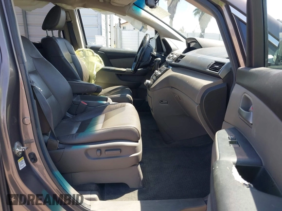 2012 Honda Odyssey Touring with VIN 5FNRL5H98CB011297, listed as a IAAI auction lot 42207061 with 154,073 mi miles and . Bid and sale history available at DreamBid. Image 5.