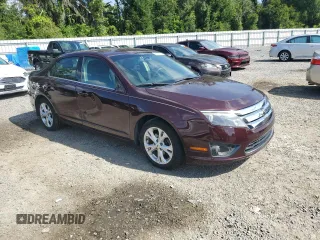2012 Ford Fusion SE with VIN 3FAHP0HA0CR291458, listed as a Copart auction lot 63357165 with 122,992 mi miles and Salvage title. Bid and sale history available at DreamBid. Image 4.