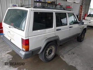1996 Jeep Cherokee Country z VIN 1J4FT78S0TL280645, wystawiony jako IAAI lot #42340813 z przebiegiem 288 418 mil mil oraz . Historia ofert i sprzedaży dostępna na DreamBid. Obrazek 4.