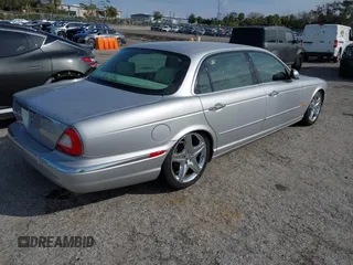 2005 Jaguar XJ with VIN SAJWA79C05SG45650, listed as a IAAI auction lot 41262315 with 76,127 mi miles. Bid and sale history available at carsss.com. Image 4.