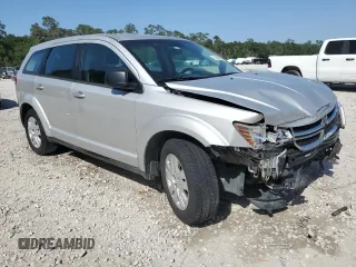 2013 Dodge Journey American Value with VIN 3C4PDCAB1DT715799, listed as a Copart auction lot 52404815 with 185,559 mi miles and Salvage Title. Bid and sale history available at DreamBid. Image 4.